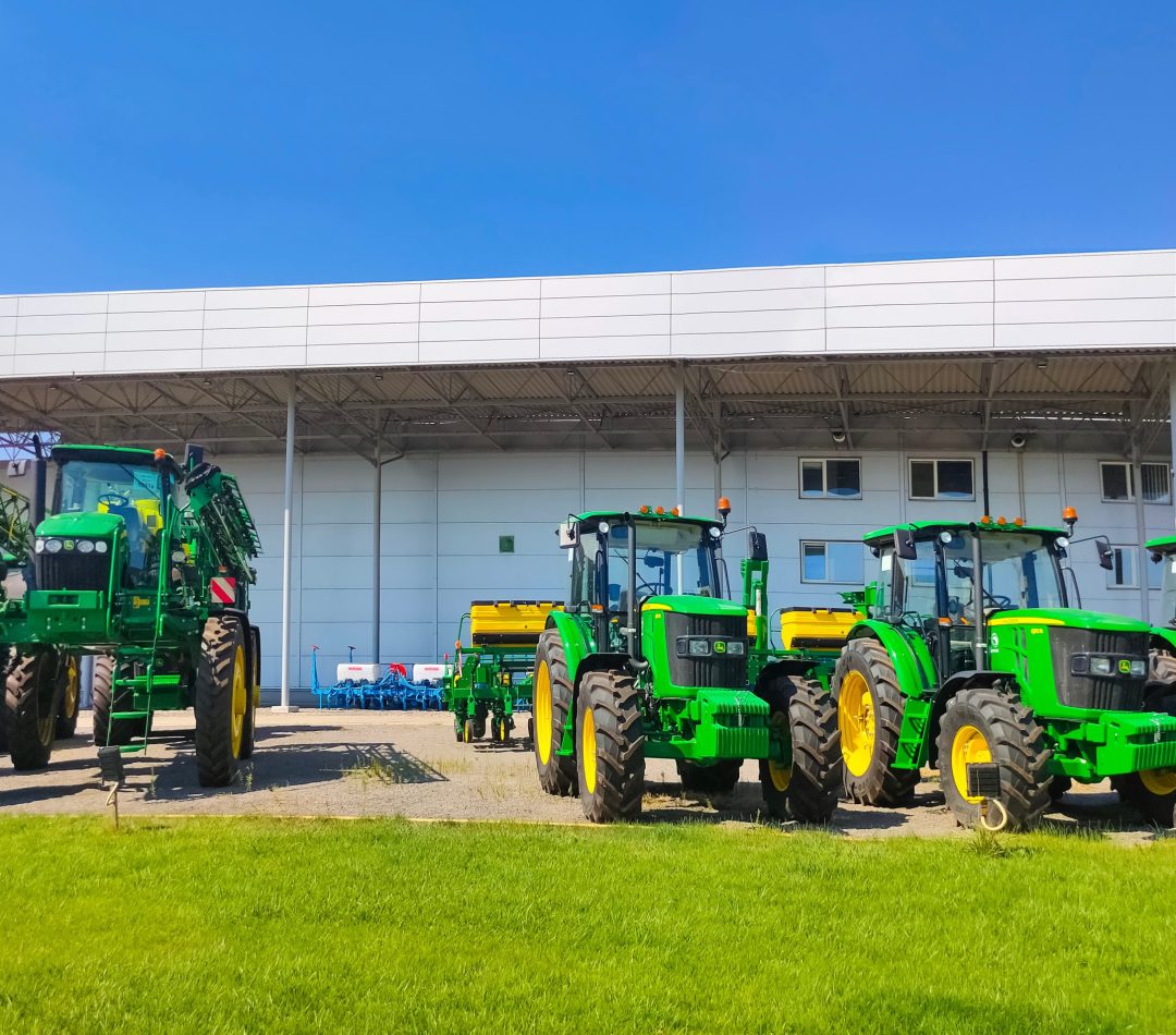 Kyiv, Ukraine – August 24, 2020: The Powerful tractors at John Deer store at Kyiv, Ukraine Kyiv, Ukraine - August 24, 2020: The Powerful tractors at John Deer store at Kyiv, Ukraine on June 16, 2020. Row of brand new John Deere tractors outside the store of local consortium, exhibition of latest agricultural machinery.
